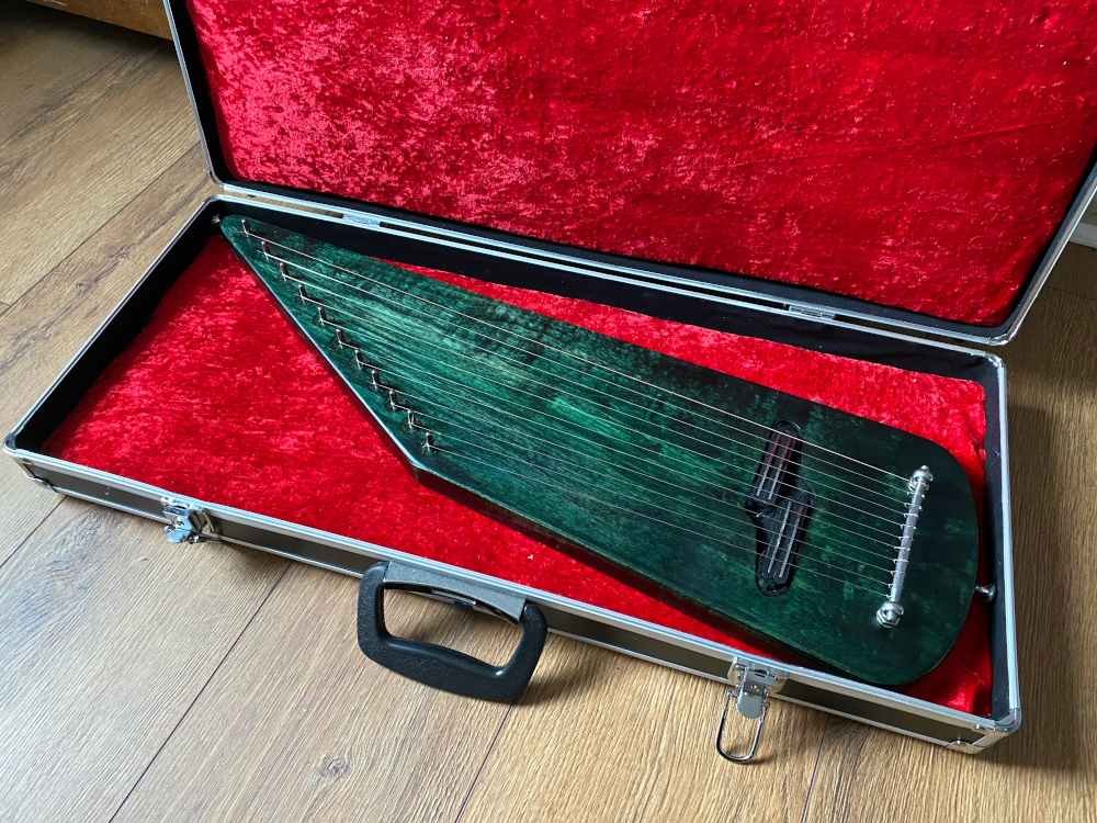 electric solidbody kantele in case   green oil and wax finish